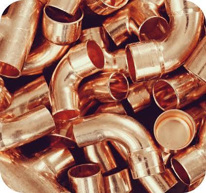 Copper plated industrial pipe fitting for plumbing systems