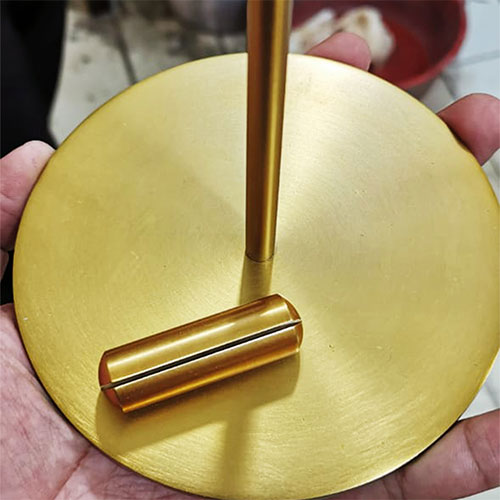 Gold plated metal with satin brushed texture